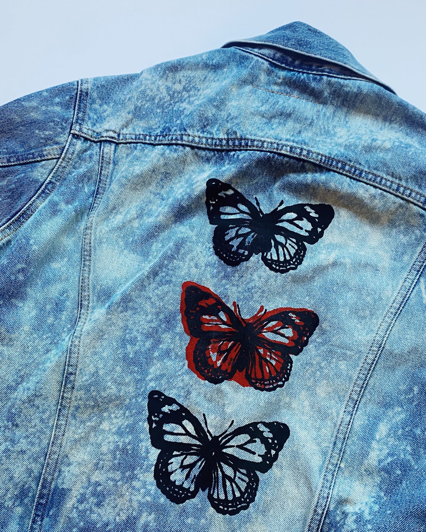 triple butterfly bleached denim jacket