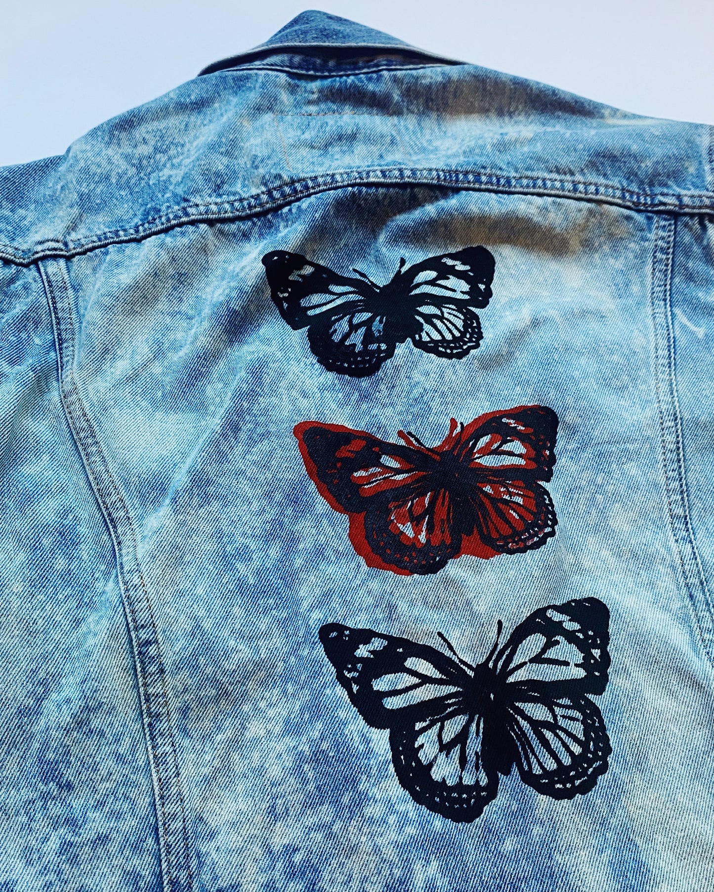 triple butterfly bleached denim jacket